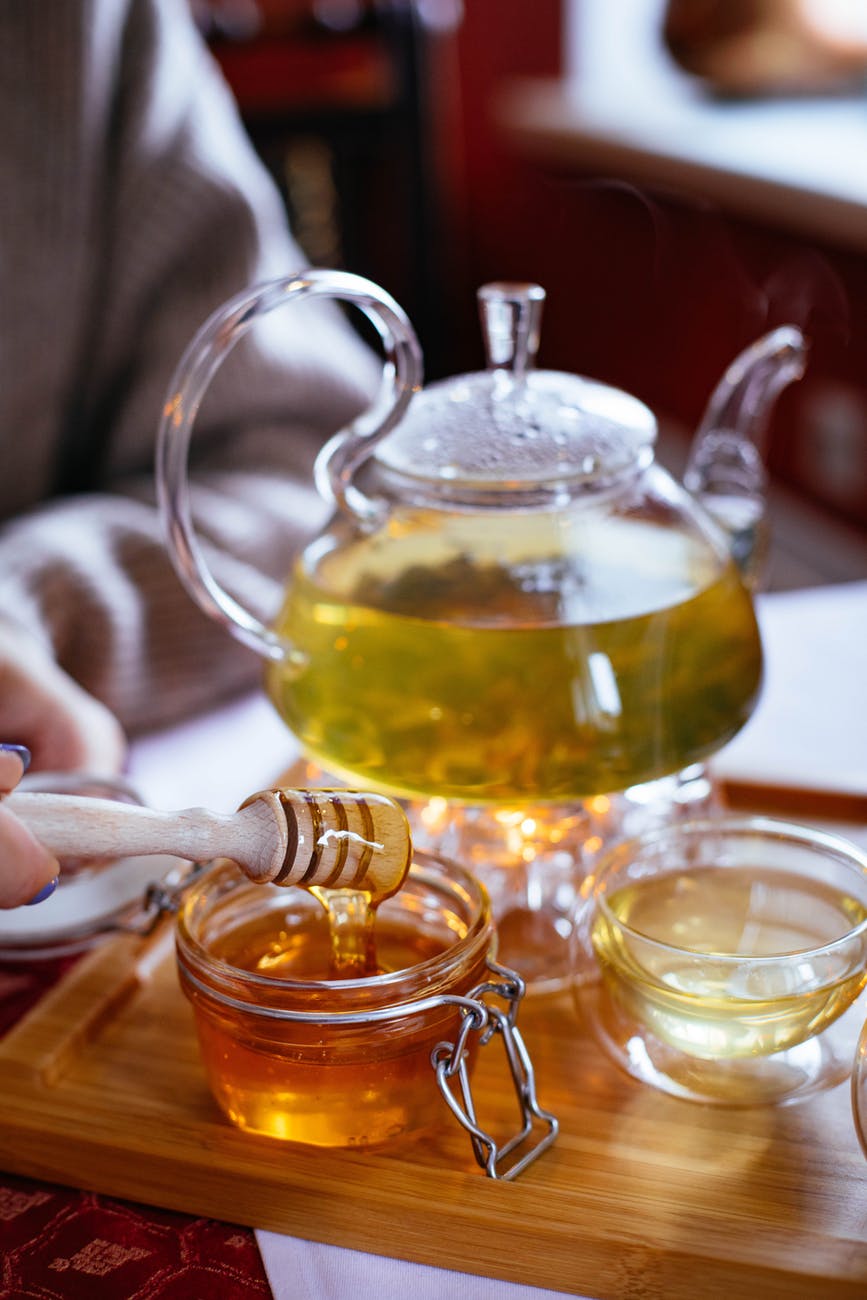 clear glass tea set with honey